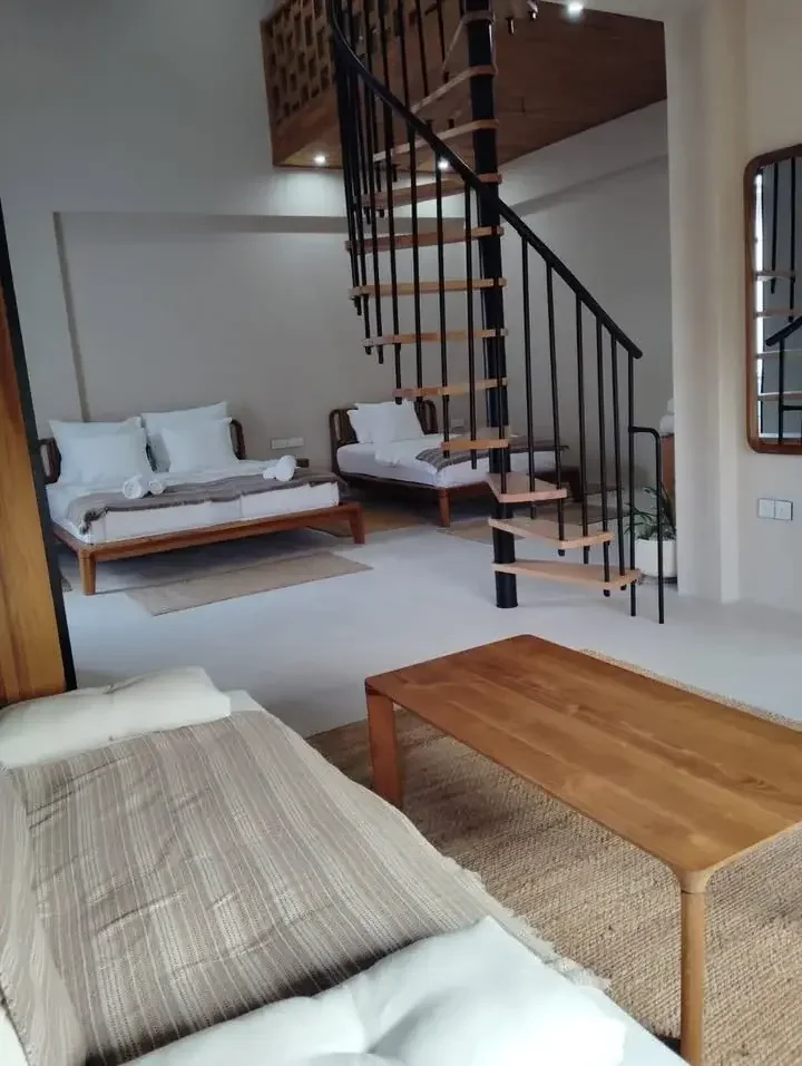 Family Room — living area, beds, and loft staircase